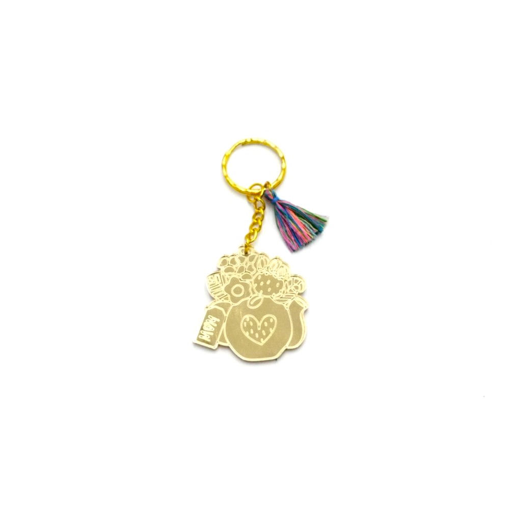 Keychain made from gold mirror plexiglass, featuring a pitcher with flowers and a colorful tassel. - 2