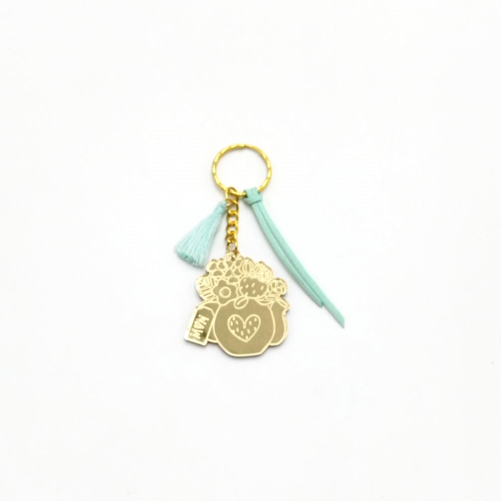 Keychain made from gold mirror plexiglass, featuring a pitcher with flowers and mint green details - 2