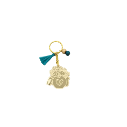 Keychain made from gold mirror plexiglass, featuring a pitcher with flowers and mint details - 